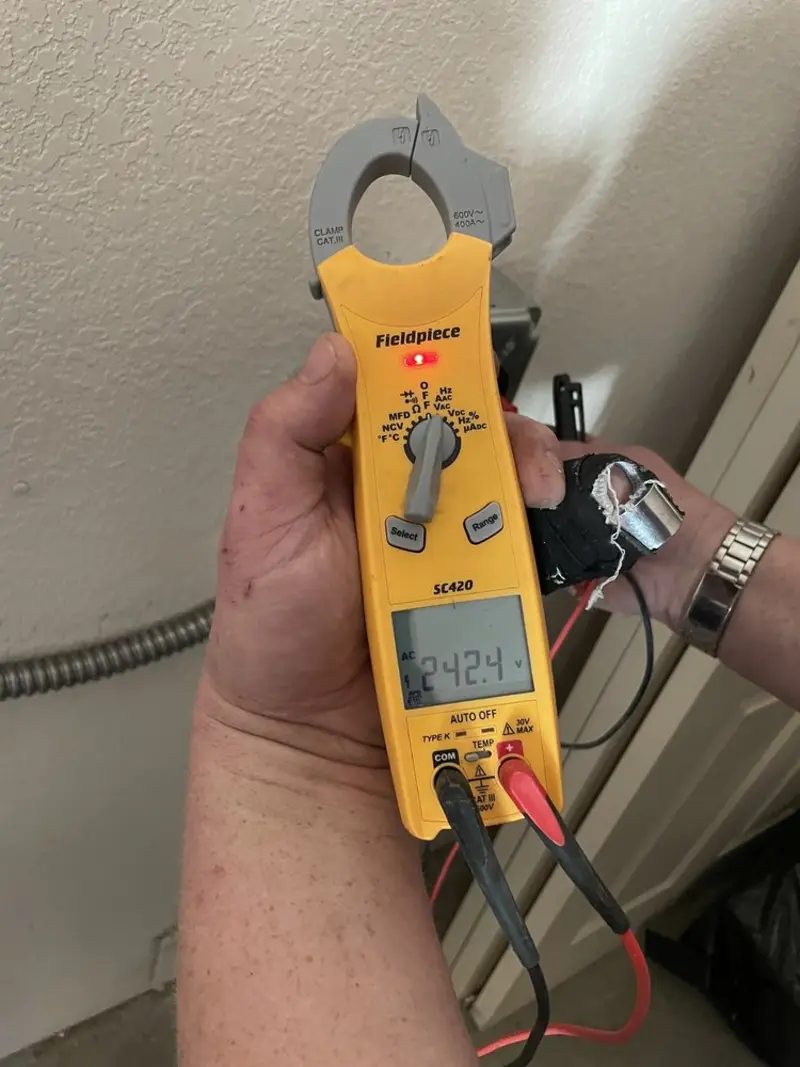 Voltage testing with clamp meter during Outlet Installation in Ripon